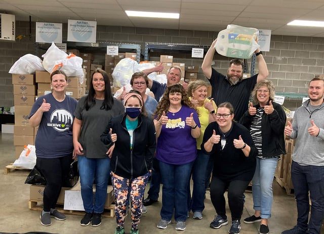 The Thomas McGee team volunteering by putting together hygiene kits