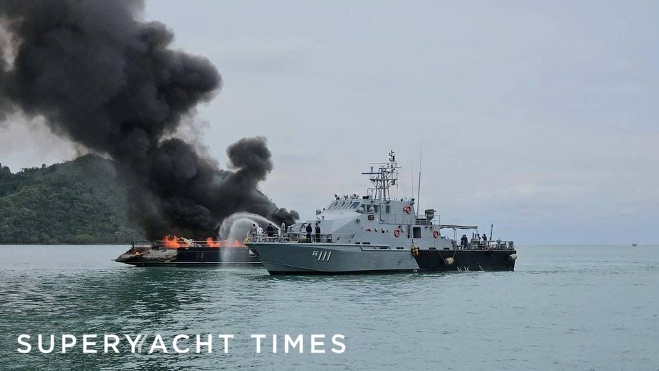 A yacht on fire and a coast guard boat tending to the fire: @royalthainavy_rtn / Instagram